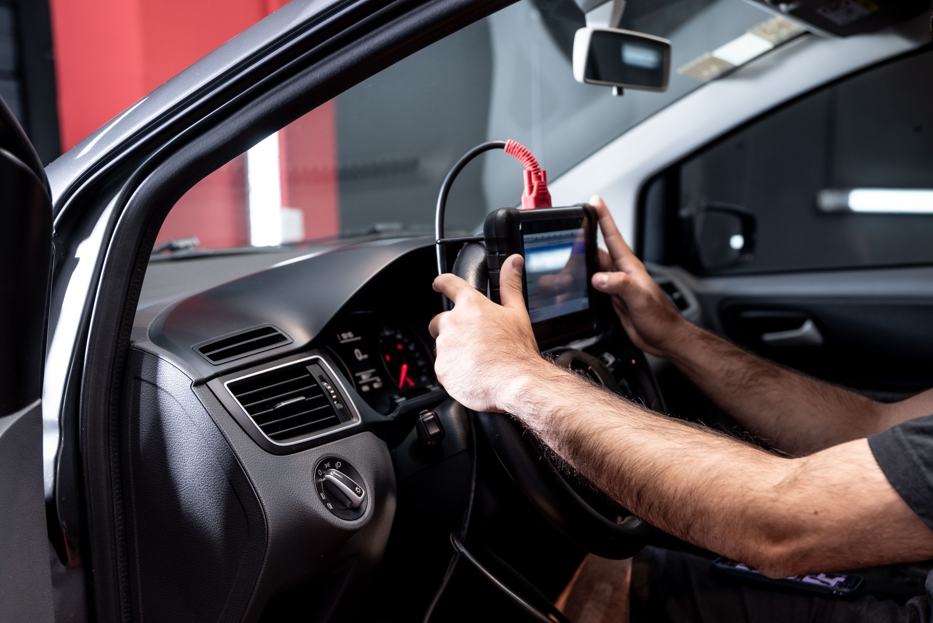 Automotive diagnostic scanner connected to the vehicle system